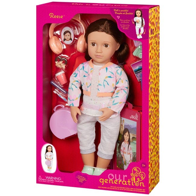 OUR GENERATION REESE TRAVEL AND STORYBOOK SET DOLL