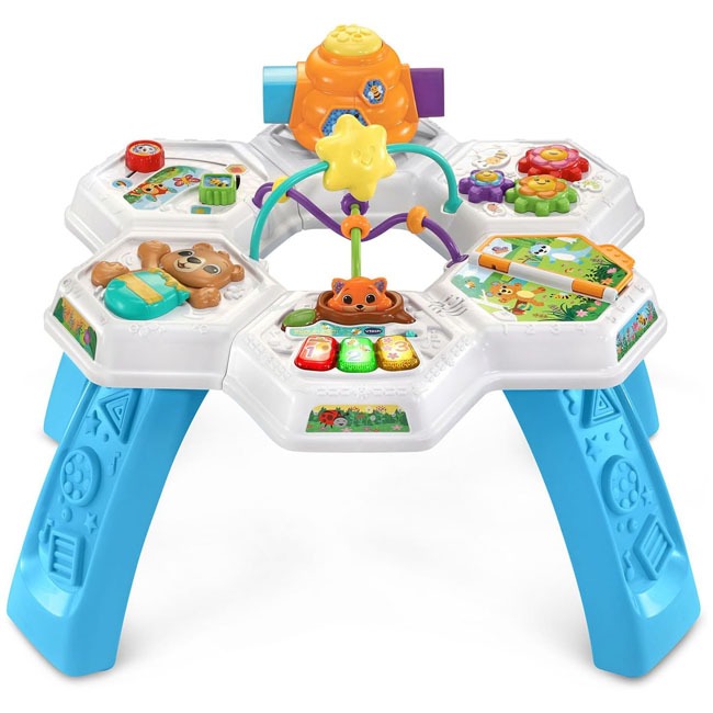 VTech Buzz and Learn Activity Table VTUS featuring colorful interactive play surface with buttons, lights, and musical elements, designed for babies and toddlers to support sensory development, motor skills, and early learning through engaging hands-on ac